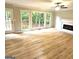 Spacious living room with lots of natural light and wood floors at 1008 Stonekirk Trce, Lawrenceville, GA 30043