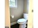 Picture showing a toilet with a window view and a toilet paper holder inside the bathroom at 1008 Stonekirk Trce, Lawrenceville, GA 30043