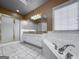 Bathroom featuring a shower stall, corner tub, granite counters and a large mirror at 340 Antebellum Way, Fayetteville, GA 30215