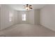 Neutral bedroom with carpet flooring, ceiling fan, and natural light from multiple windows at 340 Antebellum Way, Fayetteville, GA 30215