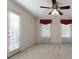 Bedroom with carpet, windows with red valances and a ceiling fan at 340 Antebellum Way, Fayetteville, GA 30215