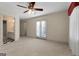 Bedroom with a ceiling fan and French doors leading to a balcony at 340 Antebellum Way, Fayetteville, GA 30215