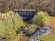 Scenic view of a blue bridge and creek with lush greenery and natural rock formations at 340 Antebellum Way, Fayetteville, GA 30215