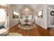 Elegant dining room with hardwood floors, chandelier, wainscoting, and bright windows at 340 Antebellum Way, Fayetteville, GA 30215