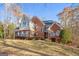 Charming brick home featuring classic architectural details, well-maintained landscaping, and inviting curb appeal at 340 Antebellum Way, Fayetteville, GA 30215