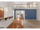 Bright foyer with hardwood floors, open floor plan, staircase to the second floor, and a view to the front door at 340 Antebellum Way, Fayetteville, GA 30215