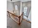 A grand foyer with a chandelier, hardwood staircase and a view of the entry door at 340 Antebellum Way, Fayetteville, GA 30215