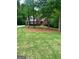 A lovely two-story brick home with green shutters and a manicured lawn at 340 Antebellum Way, Fayetteville, GA 30215