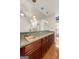 Kitchen view showcasing granite counters, wooden cabinetry and pendant lighting at 340 Antebellum Way, Fayetteville, GA 30215