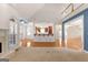 Bright, open layout with carpet and views of the kitchen, staircase, and entryway at 340 Antebellum Way, Fayetteville, GA 30215