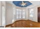 Charming sitting area with hardwood flooring, bay window, and unique blue ceiling at 340 Antebellum Way, Fayetteville, GA 30215