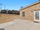 Backyard with covered patio and a lawn provides a relaxing outdoor space at 1225 Polk Xing, Mcdonough, GA 30252