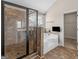 Elegant bathroom showcases a tiled glass shower, a soaking tub, and neutral finishes at 1225 Polk Xing, Mcdonough, GA 30252