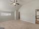 Bright bedroom featuring vaulted ceiling, ceiling fan, neutral carpet, and access to a walk-in closet at 1225 Polk Xing, Mcdonough, GA 30252