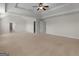 Bright bedroom featuring a trey ceiling, a ceiling fan, and multiple access doors at 1225 Polk Xing, Mcdonough, GA 30252