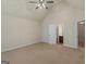 Spacious bedroom featuring neutral walls, ceiling fan and doors to other rooms at 1225 Polk Xing, Mcdonough, GA 30252