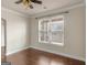 Bright bedroom with hardwood floors, neutral paint, white trim and a large window at 1225 Polk Xing, Mcdonough, GA 30252