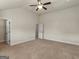 Bedroom featuring neutral walls, ceiling fan, doorways and plush carpet at 1225 Polk Xing, Mcdonough, GA 30252