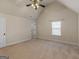 Bedroom with neutral walls, vaulted ceilings, ceiling fan and plush carpet at 1225 Polk Xing, Mcdonough, GA 30252