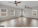 Spacious room with lots of windows and two ceiling fans for comfortable living at 1225 Polk Xing, Mcdonough, GA 30252