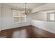 Dining area with hardwood floors, a chandelier and paneled walls at 1225 Polk Xing, Mcdonough, GA 30252