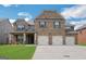 Charming two-story brick home with a three-car garage and landscaped front yard at 1225 Polk Xing, Mcdonough, GA 30252