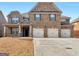 Traditional two-story brick home with a three-car garage and well-maintained lawn at 1225 Polk Xing, Mcdonough, GA 30252