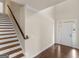 Welcoming foyer with hardwood floors, staircase, and natural light from the front door at 1225 Polk Xing, Mcdonough, GA 30252