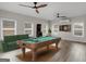 Entertainment room with a pool table, dart board, and ceiling fans at 1225 Polk Xing, Mcdonough, GA 30252