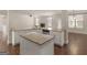 Kitchen with granite countertops, stainless steel appliances, and an island at 1225 Polk Xing, Mcdonough, GA 30252