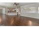 Hardwood floors, chandelier, and open layout to the kitchen enhance this living space at 1225 Polk Xing, Mcdonough, GA 30252