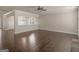 Open-concept living room with hardwood floors and chandelier at 1225 Polk Xing, Mcdonough, GA 30252
