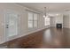 The living room features hardwood flooring, a rear door, and fireplace at 1225 Polk Xing, Mcdonough, GA 30252