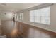 Bright living area showcases hardwood floors, natural light, and neutral wall color at 1225 Polk Xing, Mcdonough, GA 30252