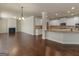 Bright, open-concept living space featuring a fireplace and a kitchen with granite countertops at 1225 Polk Xing, Mcdonough, GA 30252