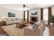 Cozy living room featuring a stone fireplace and comfortable furnishings at 1225 Polk Xing, Mcdonough, GA 30252