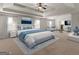 Spacious main bedroom with a vaulted ceiling, sitting area, and large windows at 1225 Polk Xing, Mcdonough, GA 30252