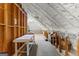 Finished attic with carpeting, insulation, and exposed wooden beams at 248 Montrose Dr, Mcdonough, GA 30253