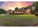 Well-manicured backyard featuring a lush lawn and professional landscaping around the home at 248 Montrose Dr, Mcdonough, GA 30253