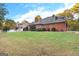 Expansive backyard features lush green lawn and a classic brick home at 248 Montrose Dr, Mcdonough, GA 30253