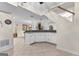 Entertaining basement area with a bar, tile floors, and an open floor plan for gatherings at 248 Montrose Dr, Mcdonough, GA 30253