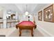 Basement recreation room featuring billiards, bar seating and built-in wall lighting at 248 Montrose Dr, Mcdonough, GA 30253