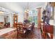 Bright dining room featuring a wooden table, area rug, and chandelier lighting at 248 Montrose Dr, Mcdonough, GA 30253