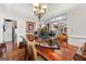 Elegant dining room with wood table, decorative centerpiece, and chandelier lighting at 248 Montrose Dr, Mcdonough, GA 30253