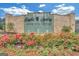 Welcoming entrance to Eagle's Landing, featuring a decorative water feature and colorful flowerbeds at 248 Montrose Dr, Mcdonough, GA 30253