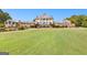 Stately clubhouse with white columns overlooking the meticulously maintained green lawn at 248 Montrose Dr, Mcdonough, GA 30253