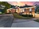 Charming brick home with manicured lawn and garden beds lining the entrance at 248 Montrose Dr, Mcdonough, GA 30253