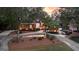 Charming brick home with landscaped front yard, mature trees, and a circular driveway at 248 Montrose Dr, Mcdonough, GA 30253