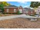 Brick home featuring mature trees, landscaping, and a driveway in a suburban setting at 248 Montrose Dr, Mcdonough, GA 30253