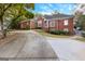 Charming brick home featuring well-manicured landscaping and an inviting driveway at 248 Montrose Dr, Mcdonough, GA 30253